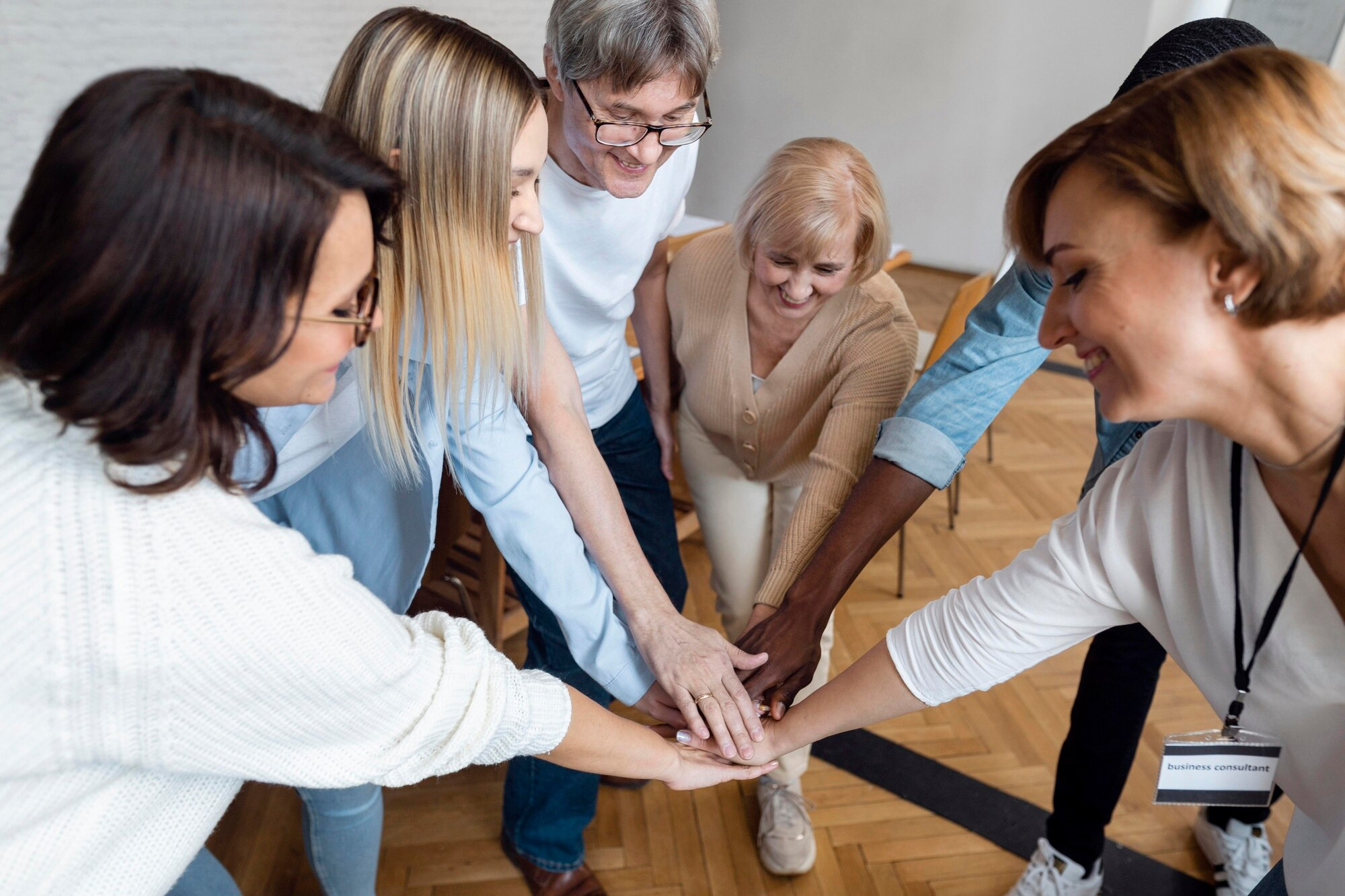Support Plus Personal Care team joining hands