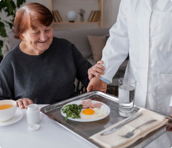 Caregiver helping senior with meal preparation
