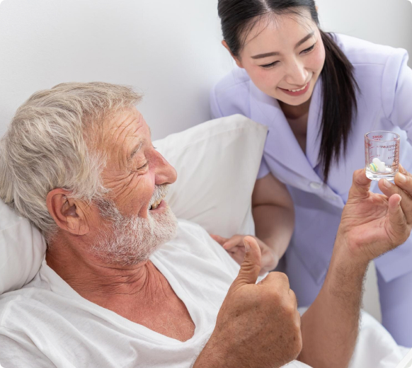 Caregiver providing medication monitoring support to elderly client