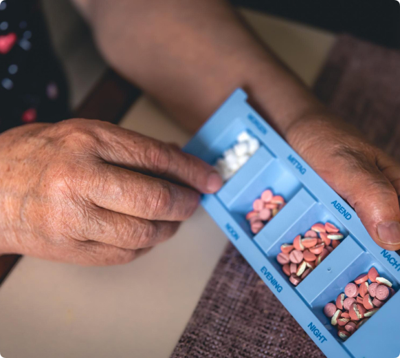 Senior receiving compassionate medication monitoring assistance
