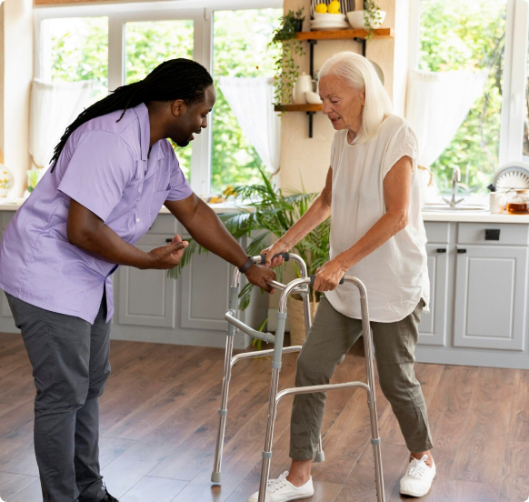 Caregiver helping senior with mobility assistance