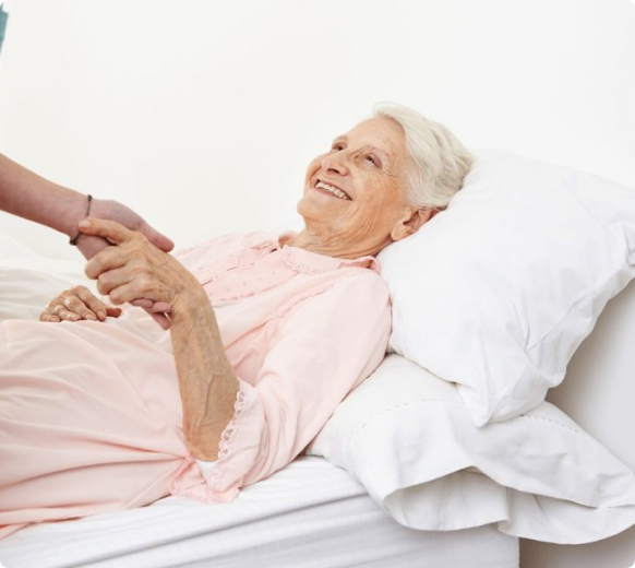 Senior receiving compassionate toileting assistance